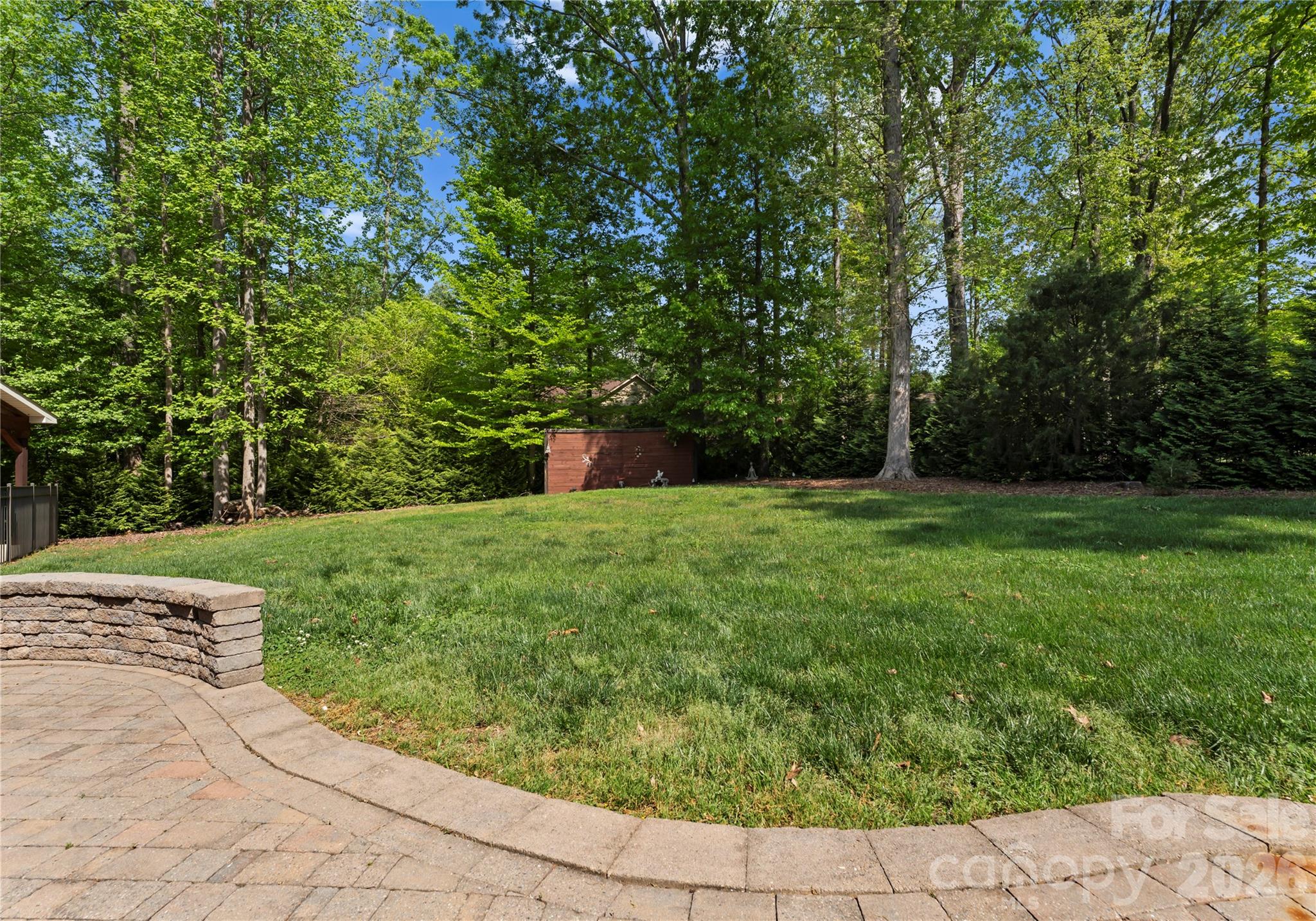 860 Arrow Point Lane Kannapolis, NC 28081 - Photo 37 of 38 a view of a garden with a bench