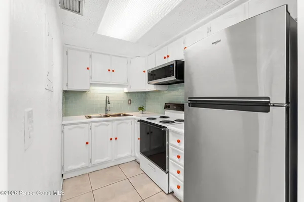 a kitchen with a stove and a microwave