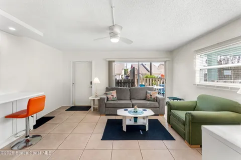 a view of a livingroom with furniture and a kitchen