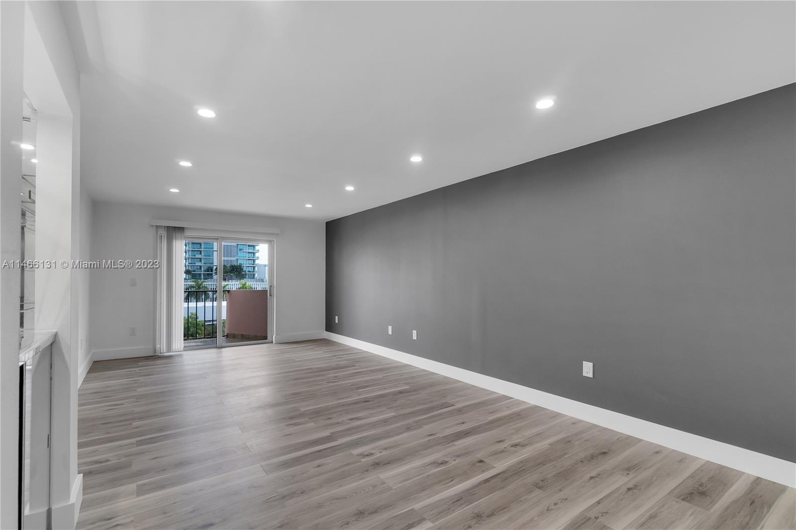6920 Harding Avenue, Unit 502 Miami Beach, FL 33141 - Photo 23 of 39 a view of a livingroom with wooden floor