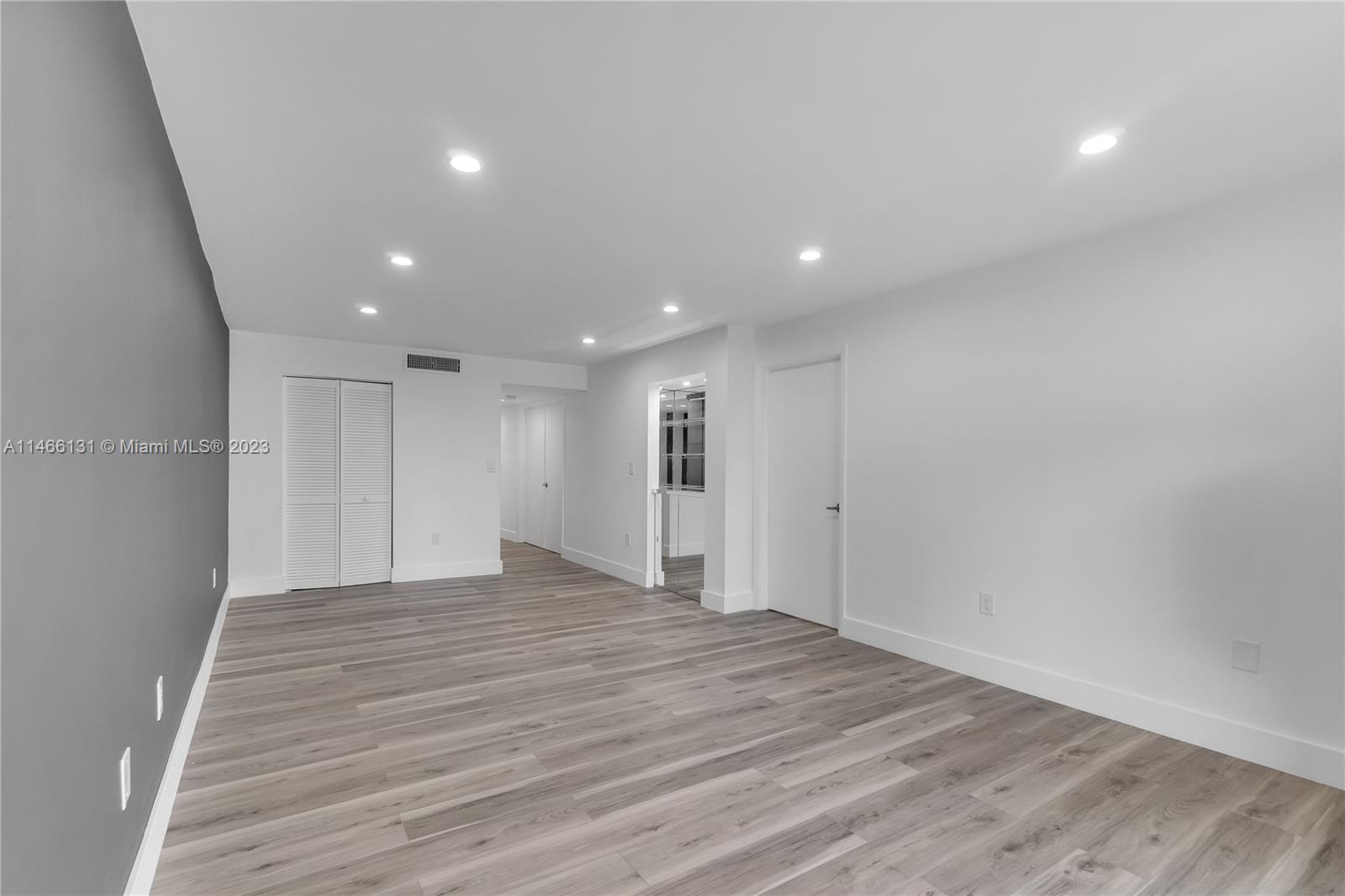 6920 Harding Avenue, Unit 502 Miami Beach, FL 33141 - Photo 25 of 39 a view of empty room with wooden floor