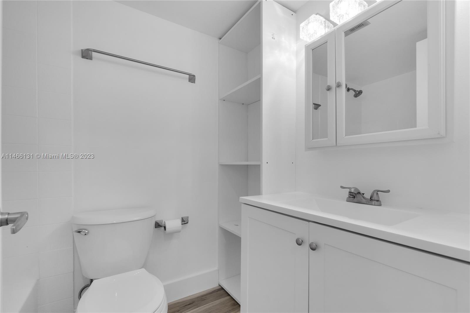 6920 Harding Avenue, Unit 502 Miami Beach, FL 33141 - Photo 29 of 39 a bathroom with a sink toilet and shower