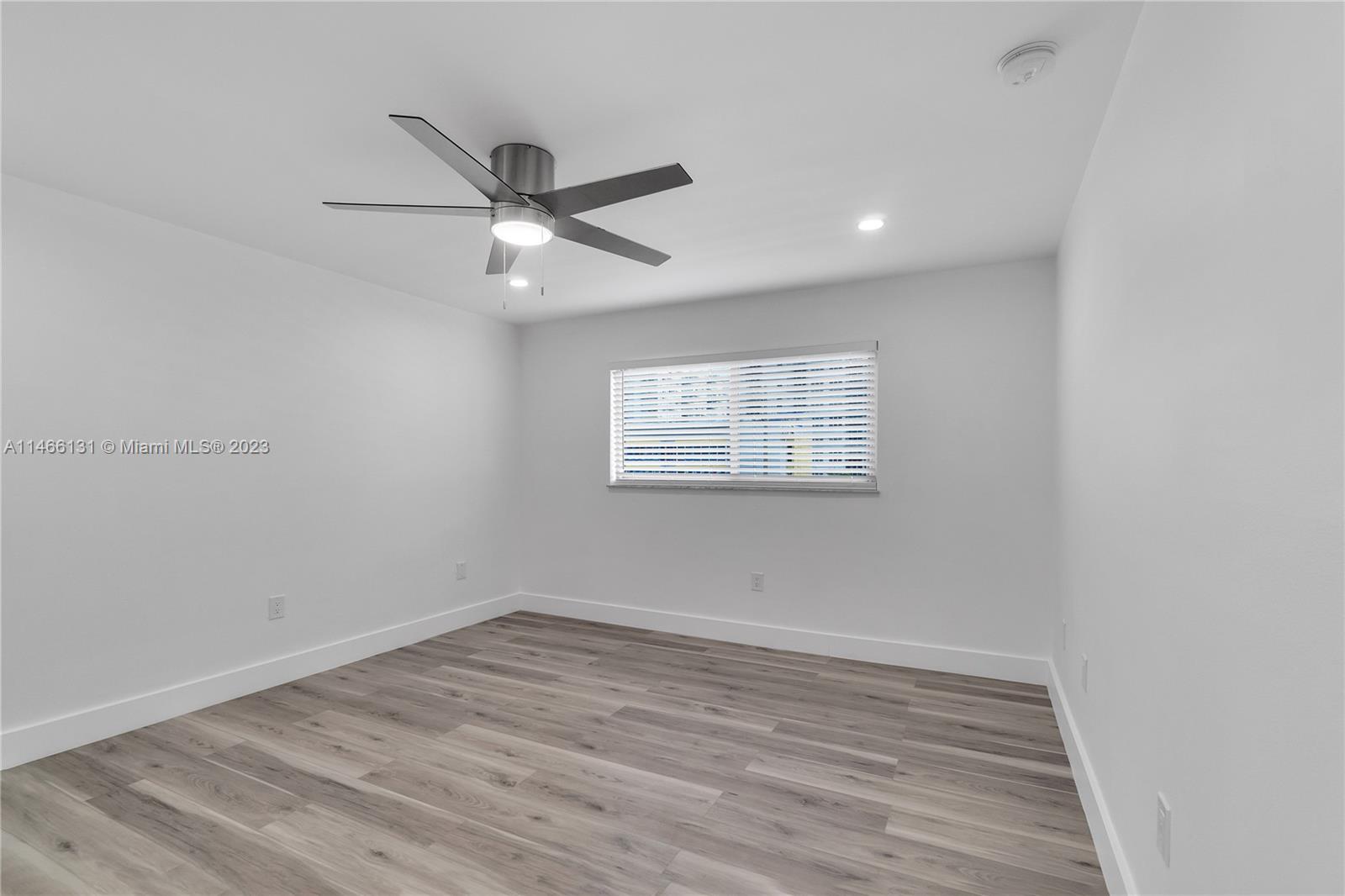 6920 Harding Avenue, Unit 502 Miami Beach, FL 33141 - Photo 31 of 39 wooden floor in an empty room