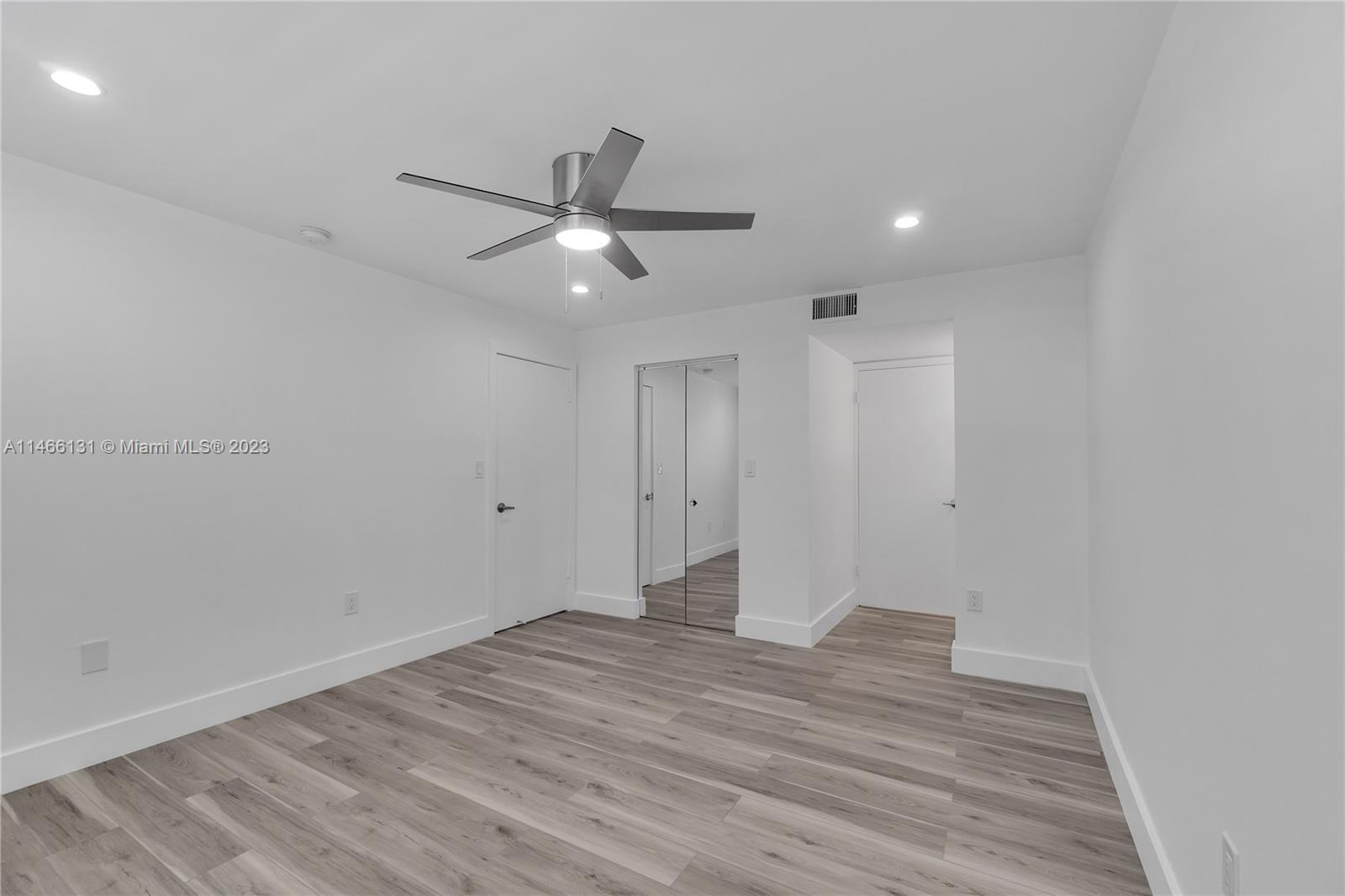 6920 Harding Avenue, Unit 502 Miami Beach, FL 33141 - Photo 32 of 39 wooden floor in an empty room