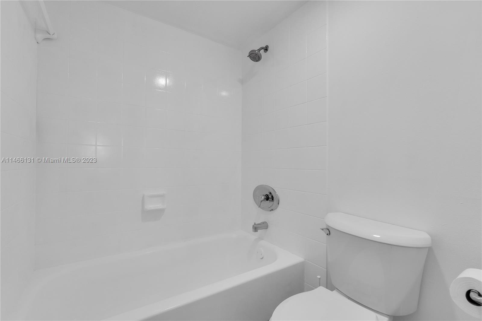 6920 Harding Avenue, Unit 502 Miami Beach, FL 33141 - Photo 35 of 39 a bathroom with a toilet and a bathtub