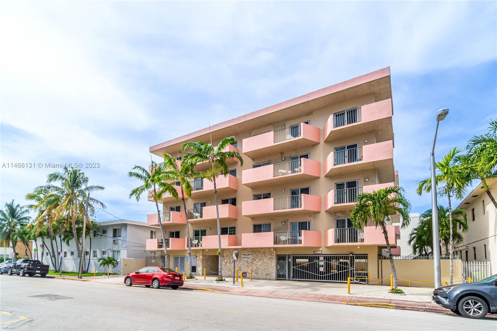 6920 Harding Avenue, Unit 502 Miami Beach, FL 33141 - Photo 5 of 39 a city street lined with buildings and cars