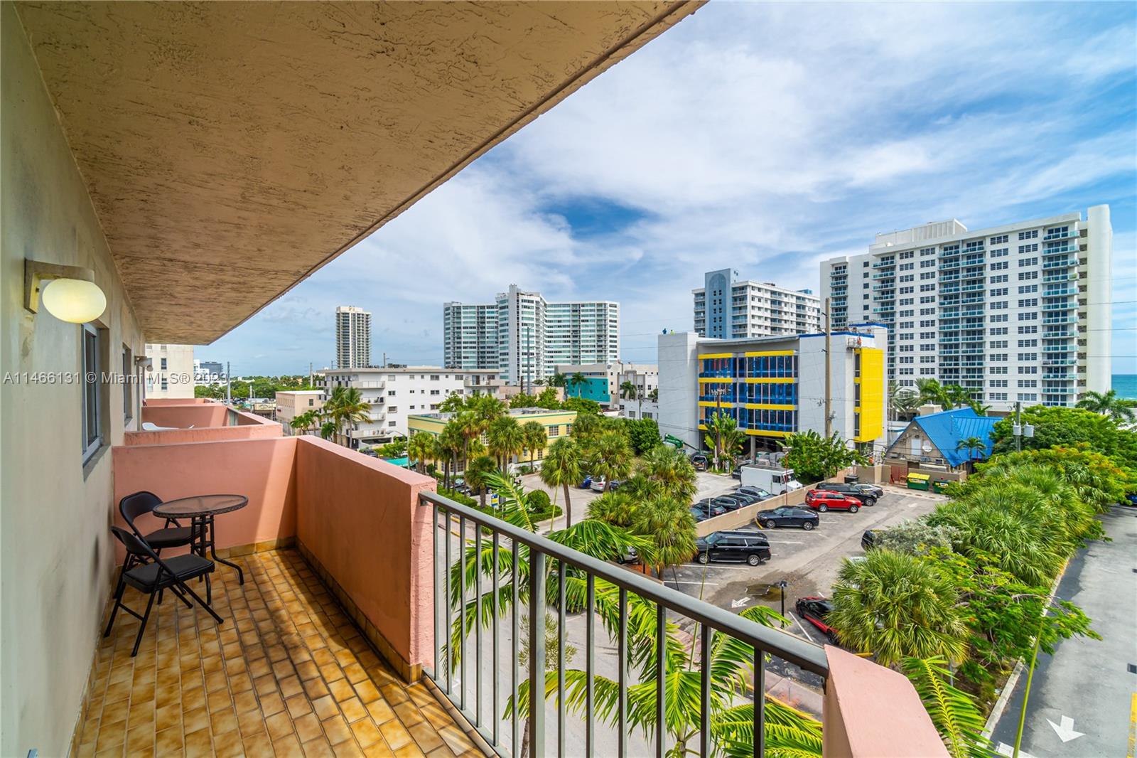 6920 Harding Avenue, Unit 502 Miami Beach, FL 33141 - Photo 6 of 39 a balcony view with couple of chairs and wooden fence