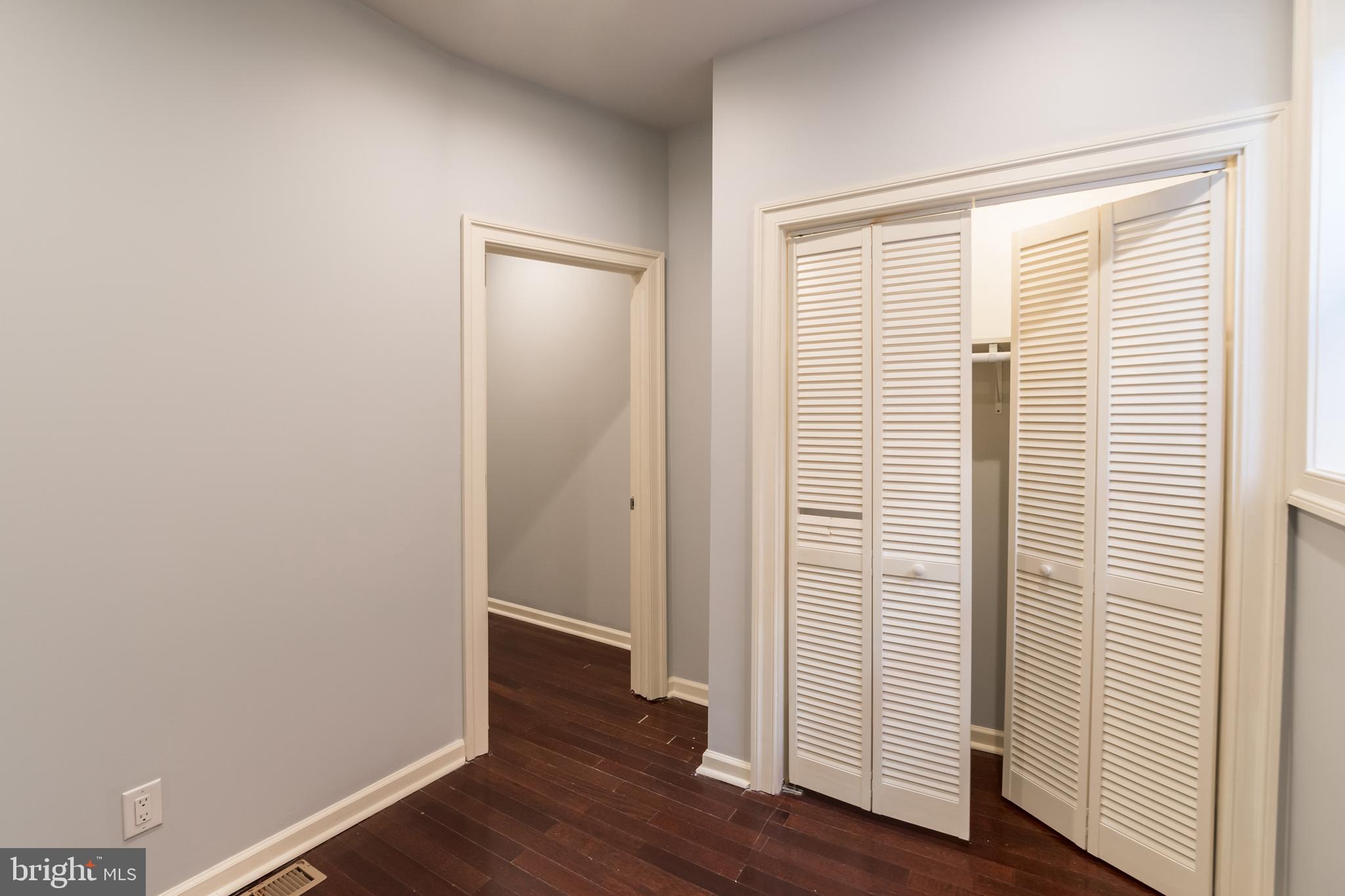 723 South 56th Street, Unit 1 Philadelphia, PA 19143 - Photo 15 of 18 an empty room with wooden floor and windows