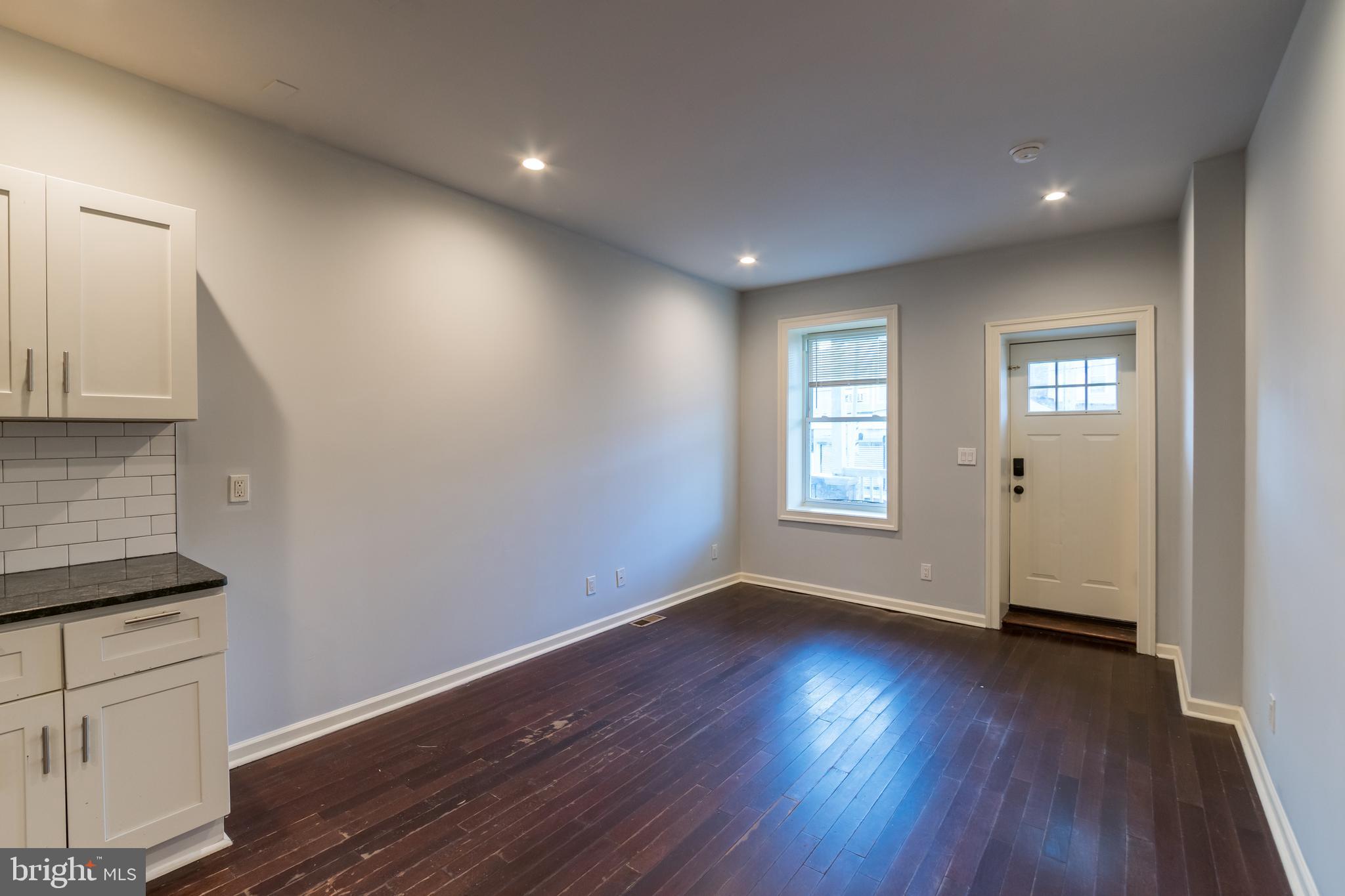 723 South 56th Street, Unit 1 Philadelphia, PA 19143 - Photo 4 of 18 a view of empty room with wooden floor and fan