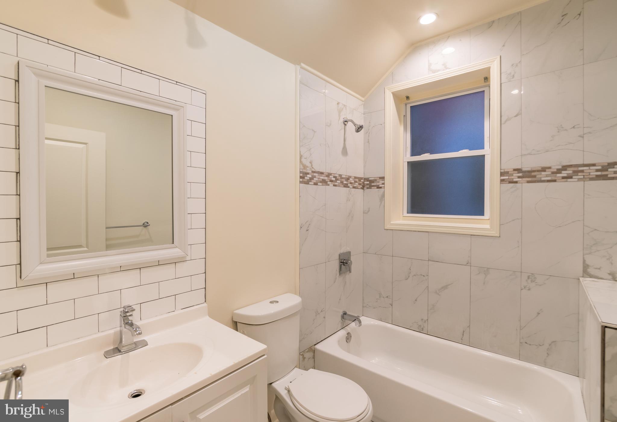 723 South 56th Street, Unit 1 Philadelphia, PA 19143 - Photo 6 of 18 a bathroom with a sink toilet and shower