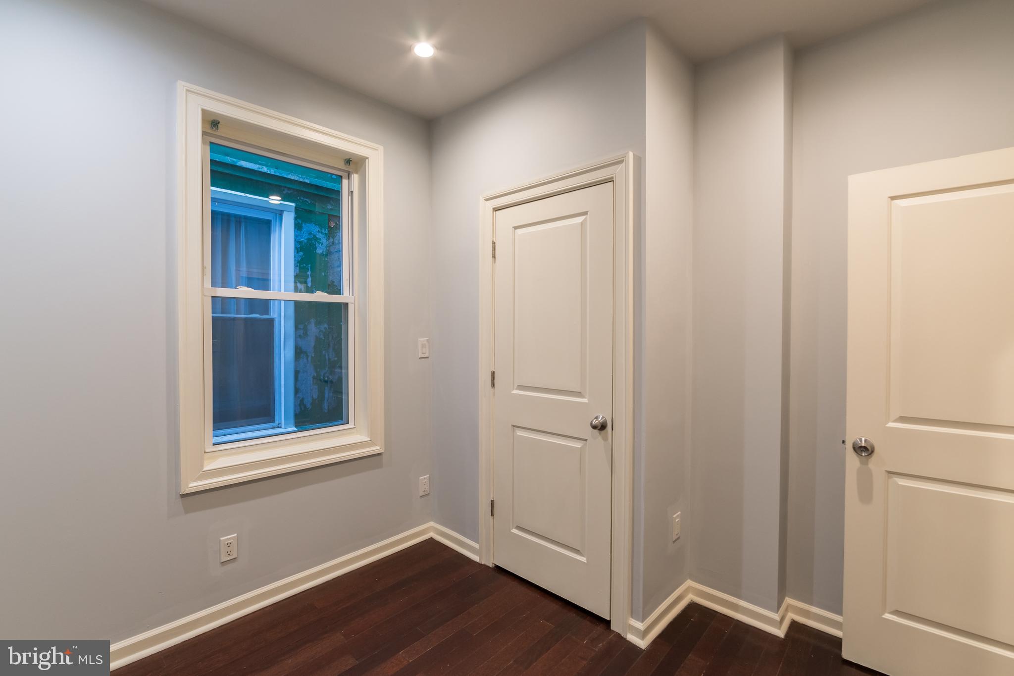 723 South 56th Street, Unit 1 Philadelphia, PA 19143 - Photo 8 of 18 a view of an empty room with wooden floor and closet
