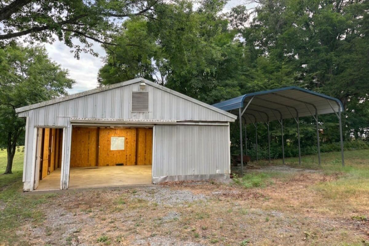 1069 Pecks Road Bedford, VA 24523 - Photo 32 of 47 Garage with concrete floor and electric