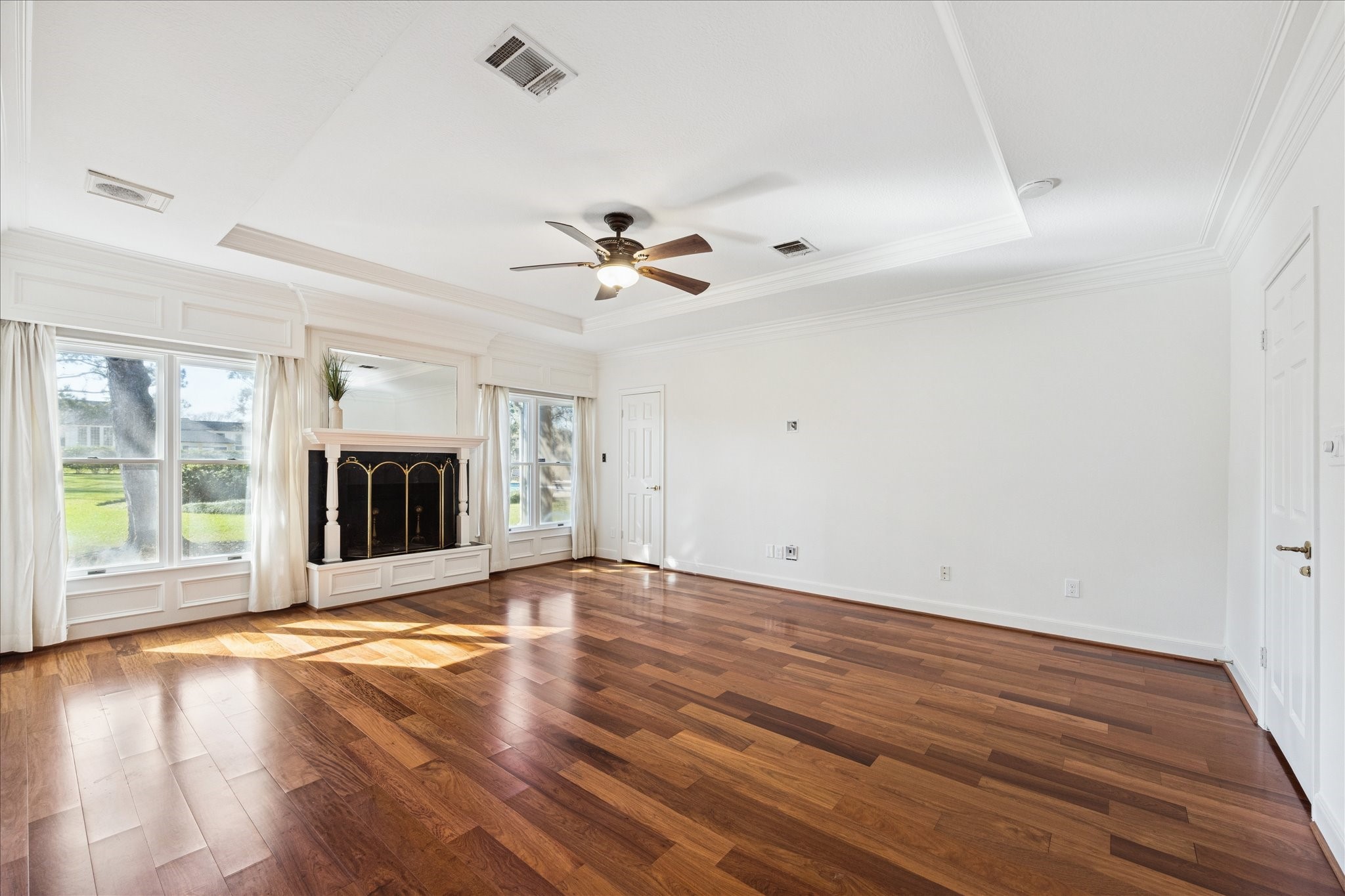 6611 Riva Ridge Drive Richmond, TX 77406 - Photo 25 of 46 The primary bedroom offers a wood burning fireplace and an abundance of natural light.