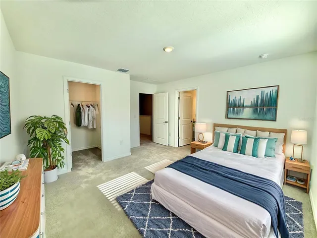 a bedroom with a balcony a bed and a couch