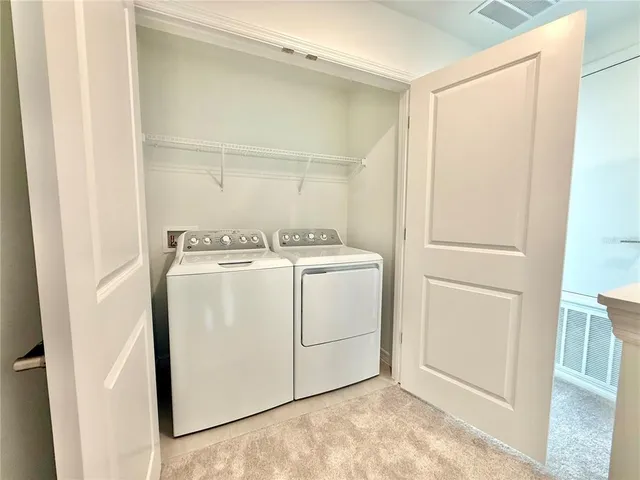 a view of a chairs and table in patio