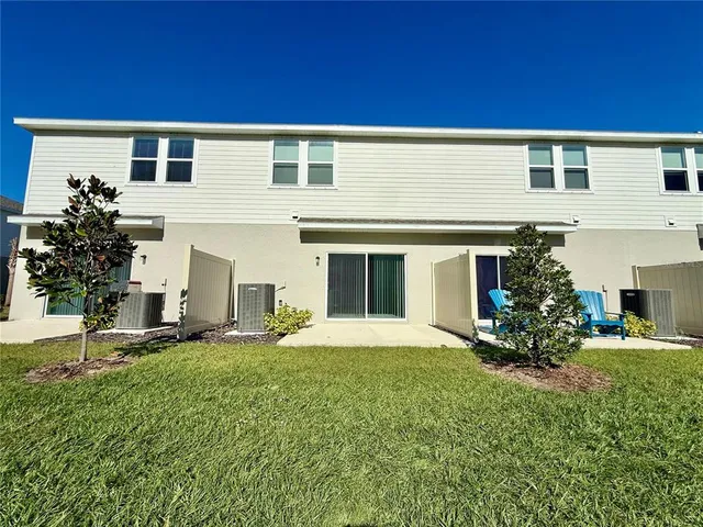 a balcony with wooden floor and city view