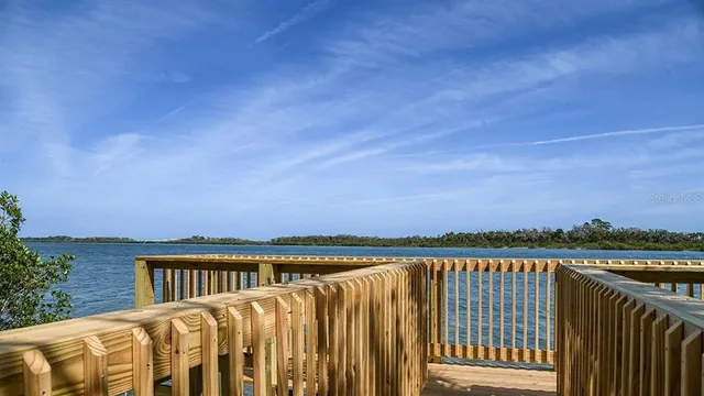a view of a backyard with sitting area
