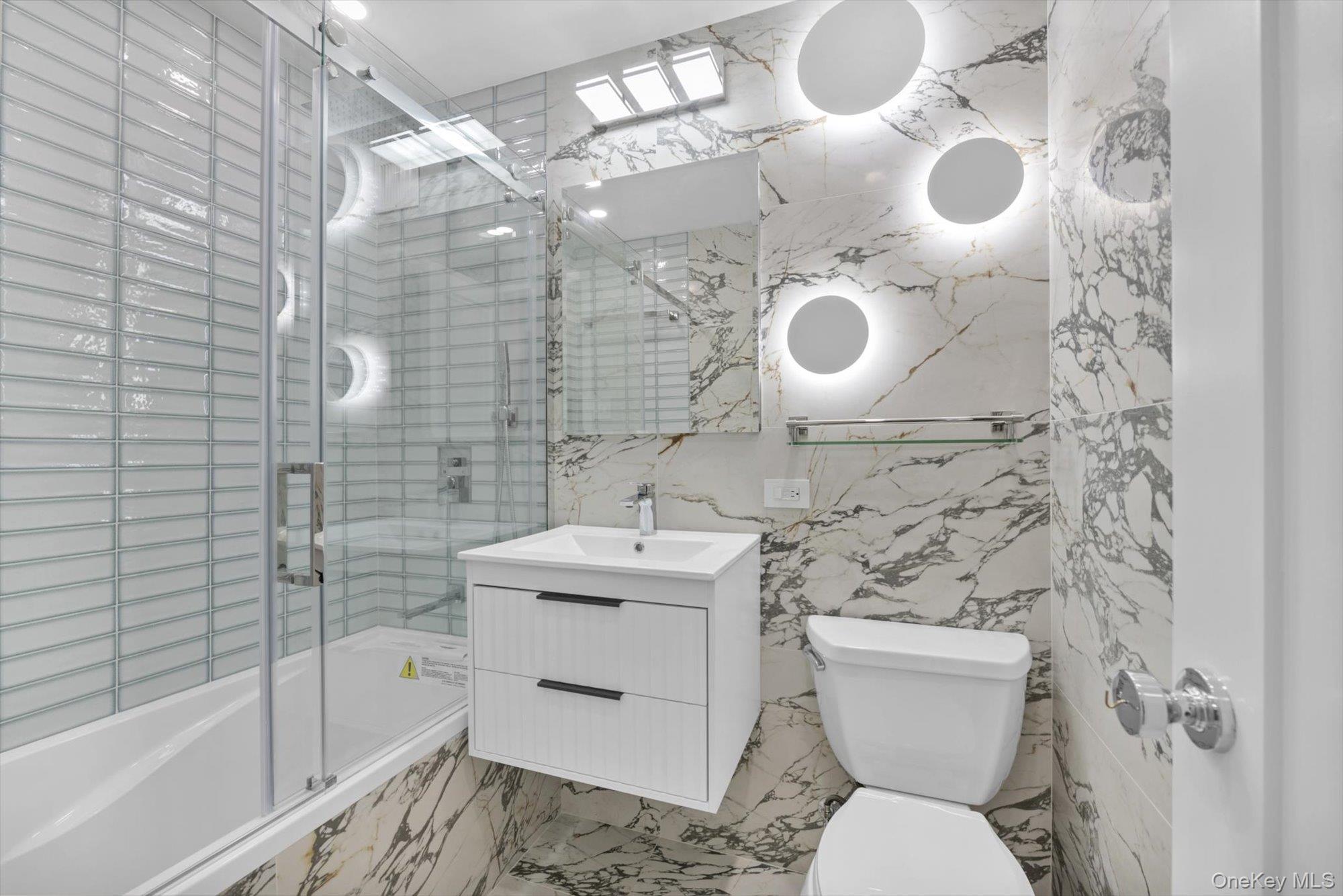 555 Kappock Street, Unit 12G Bronx, NY 10463 - Photo 12 of 19 a bathroom with a toilet sink and shower