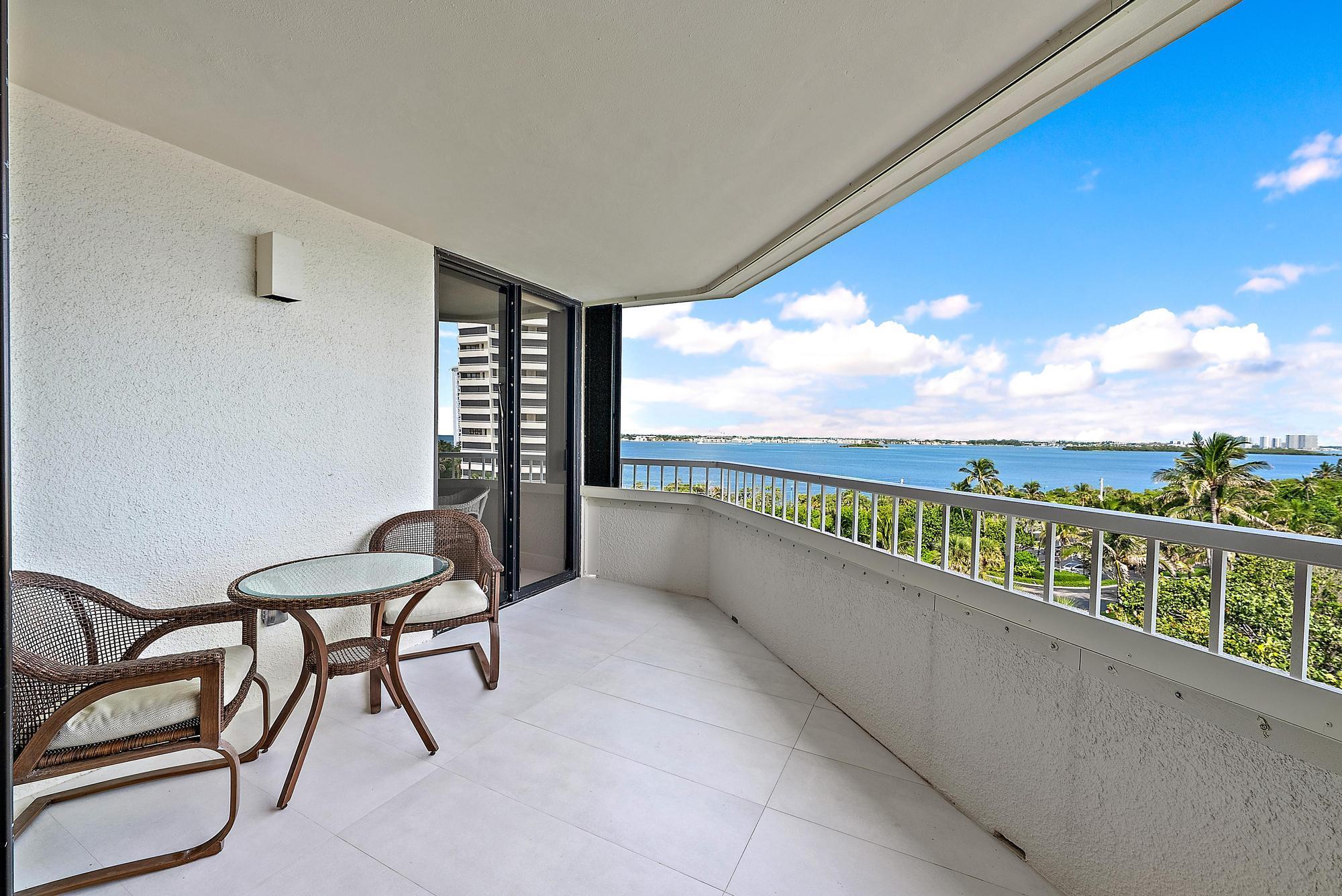 5070 North Ocean Drive, Unit 5B Riviera Beach, FL 33404 - Photo 19 of 37 a view of a city from a balcony with furniture