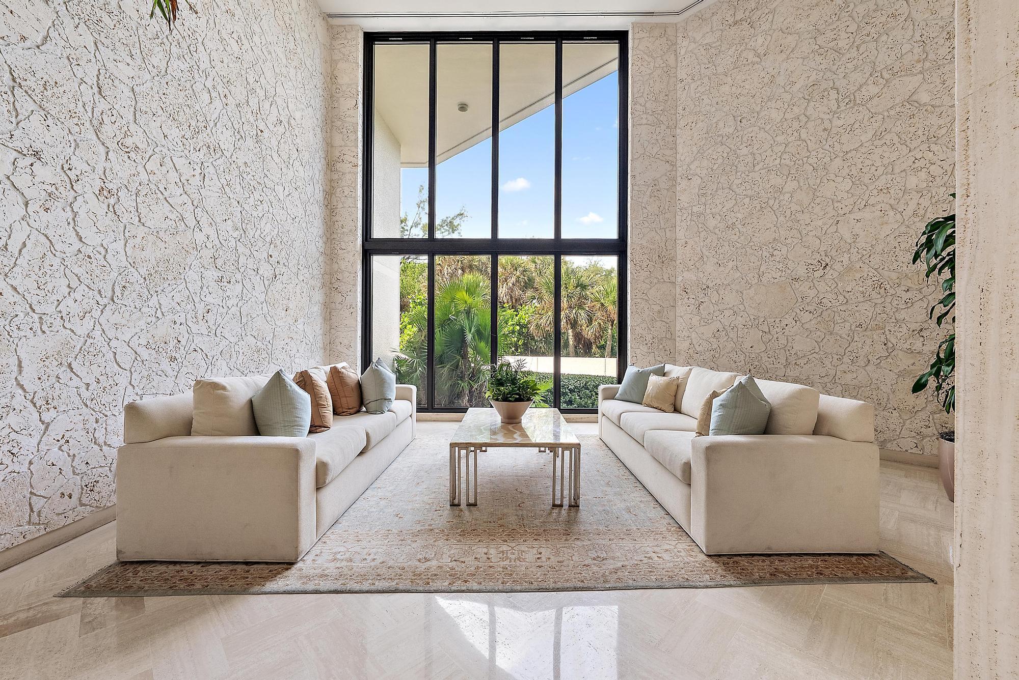 5070 North Ocean Drive, Unit 5B Riviera Beach, FL 33404 - Photo 25 of 37 a living room with furniture and a large window