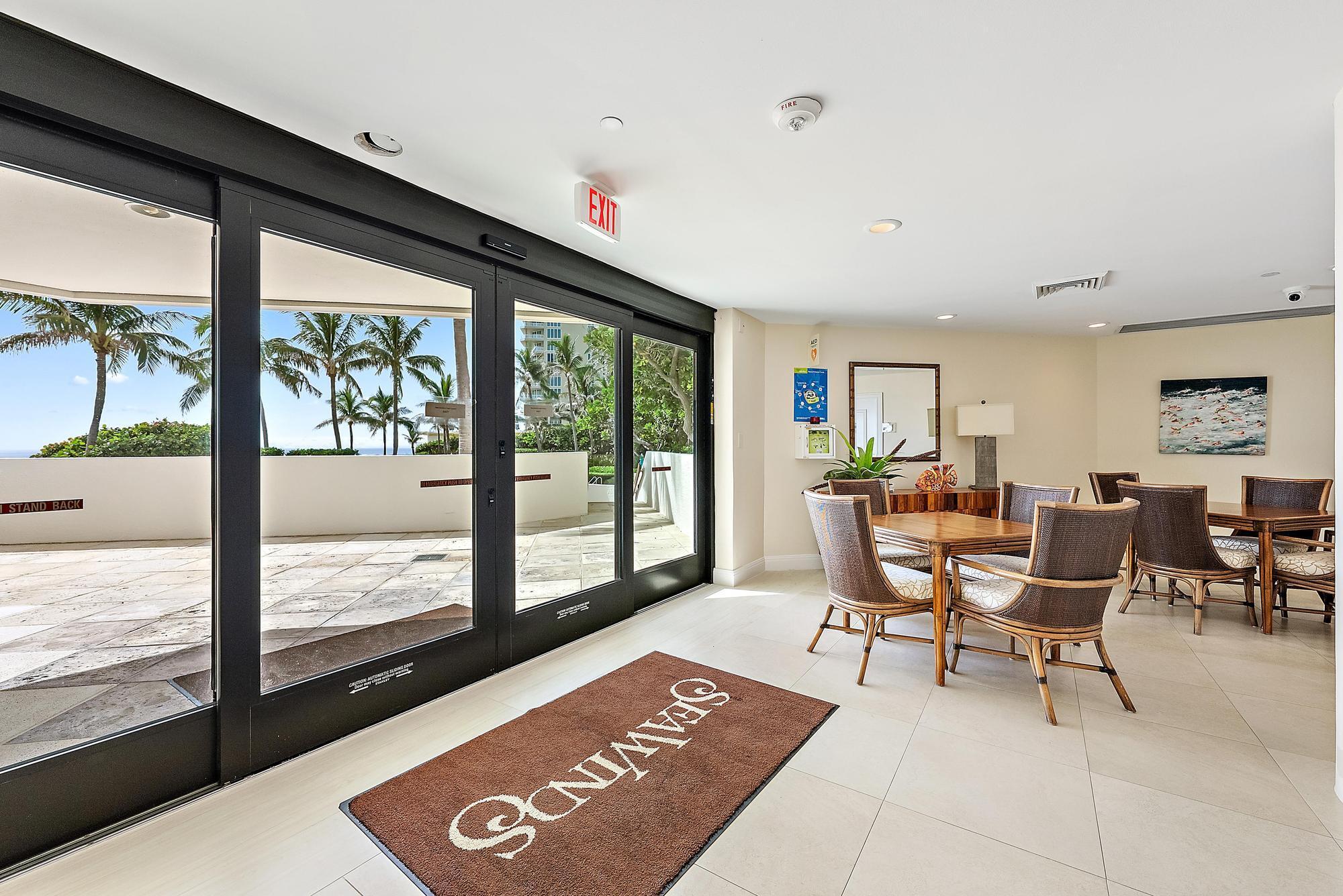 5070 North Ocean Drive, Unit 5B Riviera Beach, FL 33404 - Photo 28 of 37 a living room with furniture and a large window