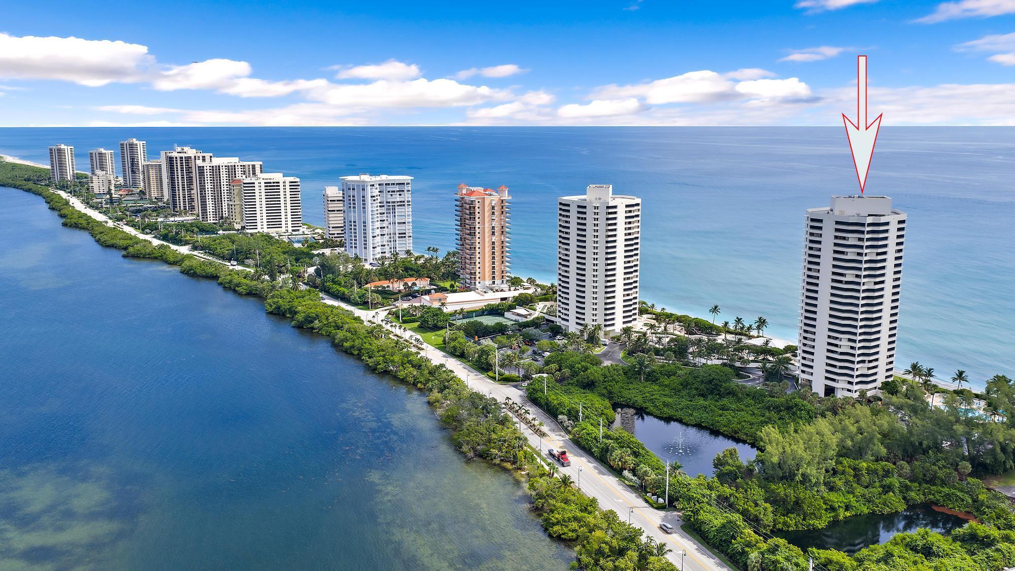 5070 North Ocean Drive, Unit 5B Riviera Beach, FL 33404 - Photo 3 of 37 a view of a city and an ocean from a balcony