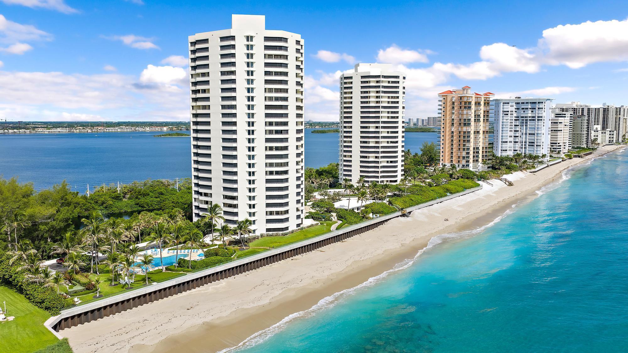 5070 North Ocean Drive, Unit 5B Riviera Beach, FL 33404 - Photo 31 of 37 a view of balcony with a couple of cars parked in front of it