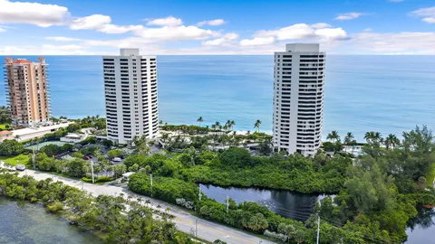 a view of a city and an ocean from a balcony