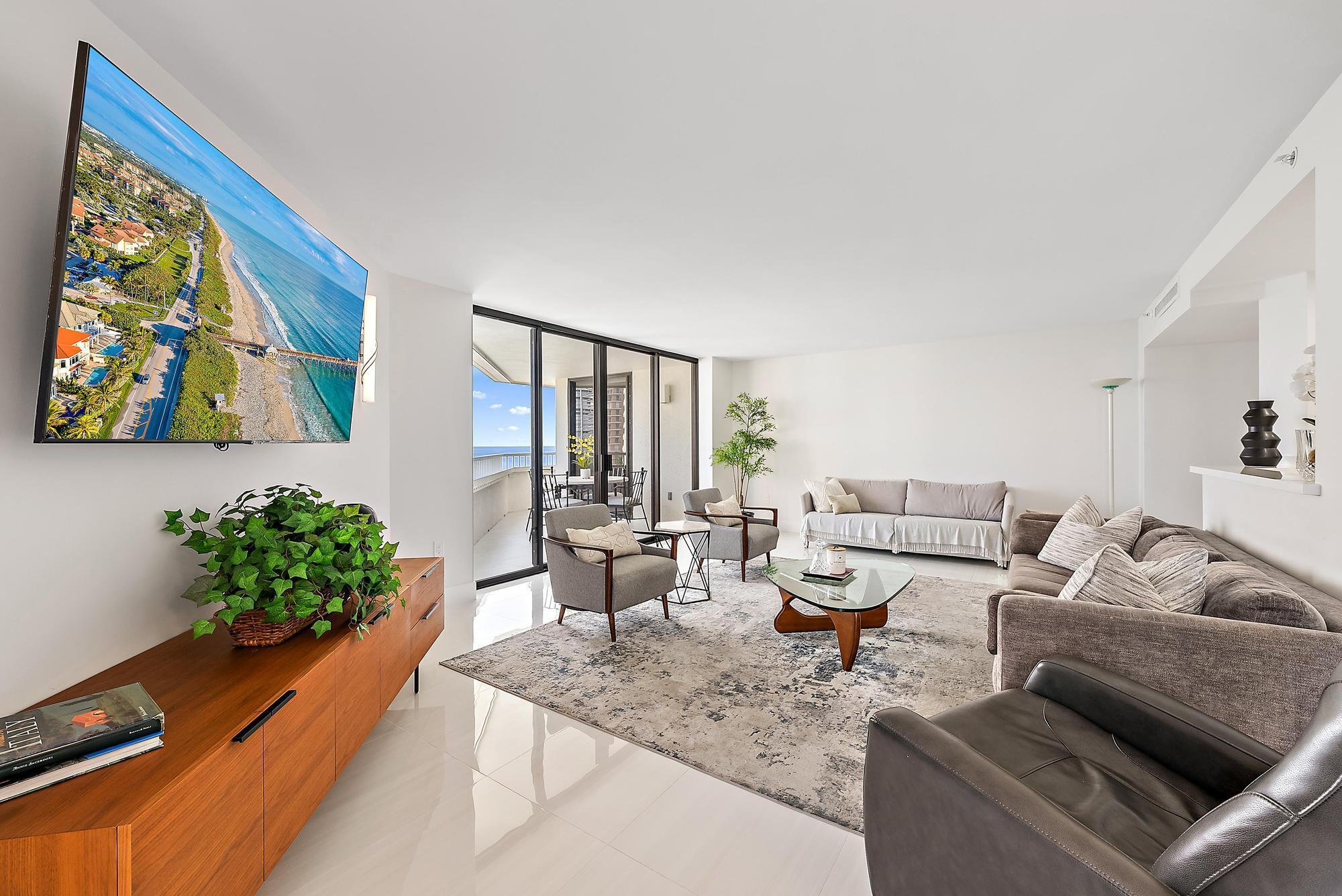 5070 North Ocean Drive, Unit 5B Riviera Beach, FL 33404 - Photo 6 of 37 a living room with furniture and flowers
