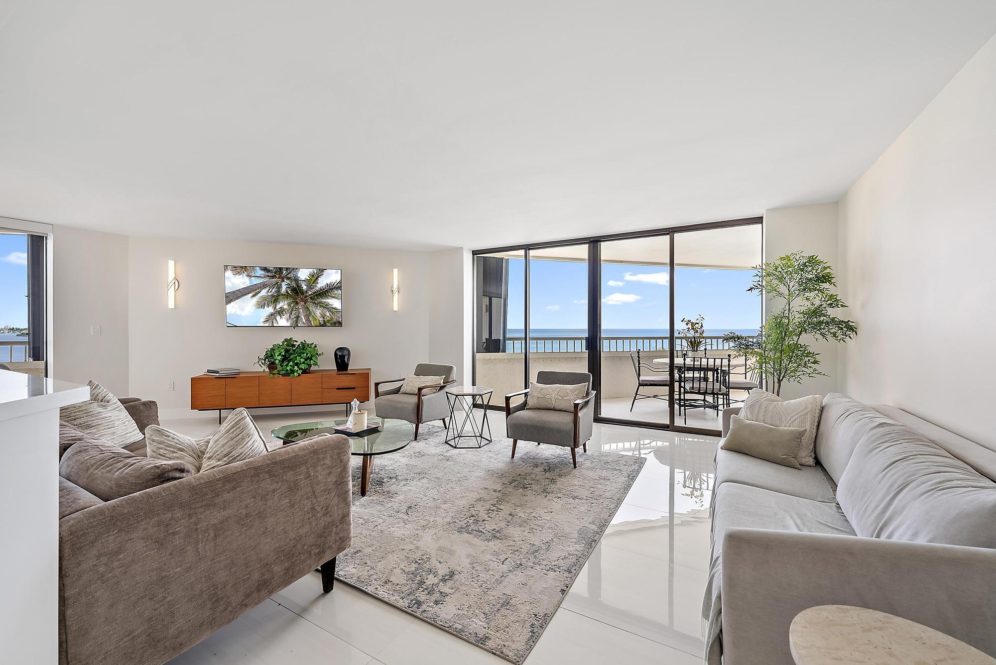 5070 North Ocean Drive, Unit 5B Riviera Beach, FL 33404 - Photo 7 of 37 a living room with furniture and a large window