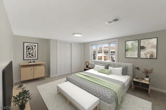 a bedroom with a large bed and a window