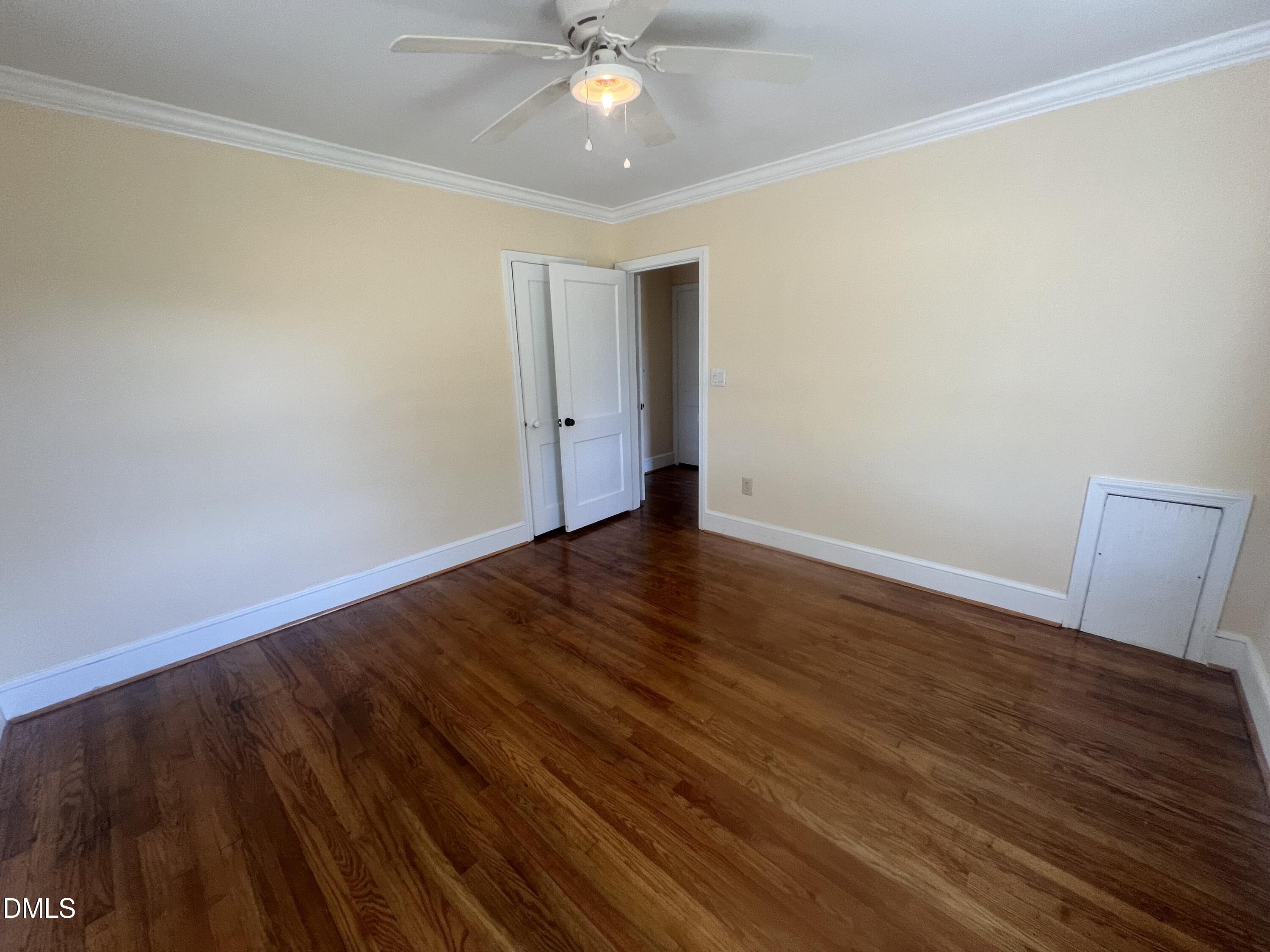 122 Bill Avery Road Coats, NC 27521 - Photo 16 of 51 a view of an empty room with wooden floor