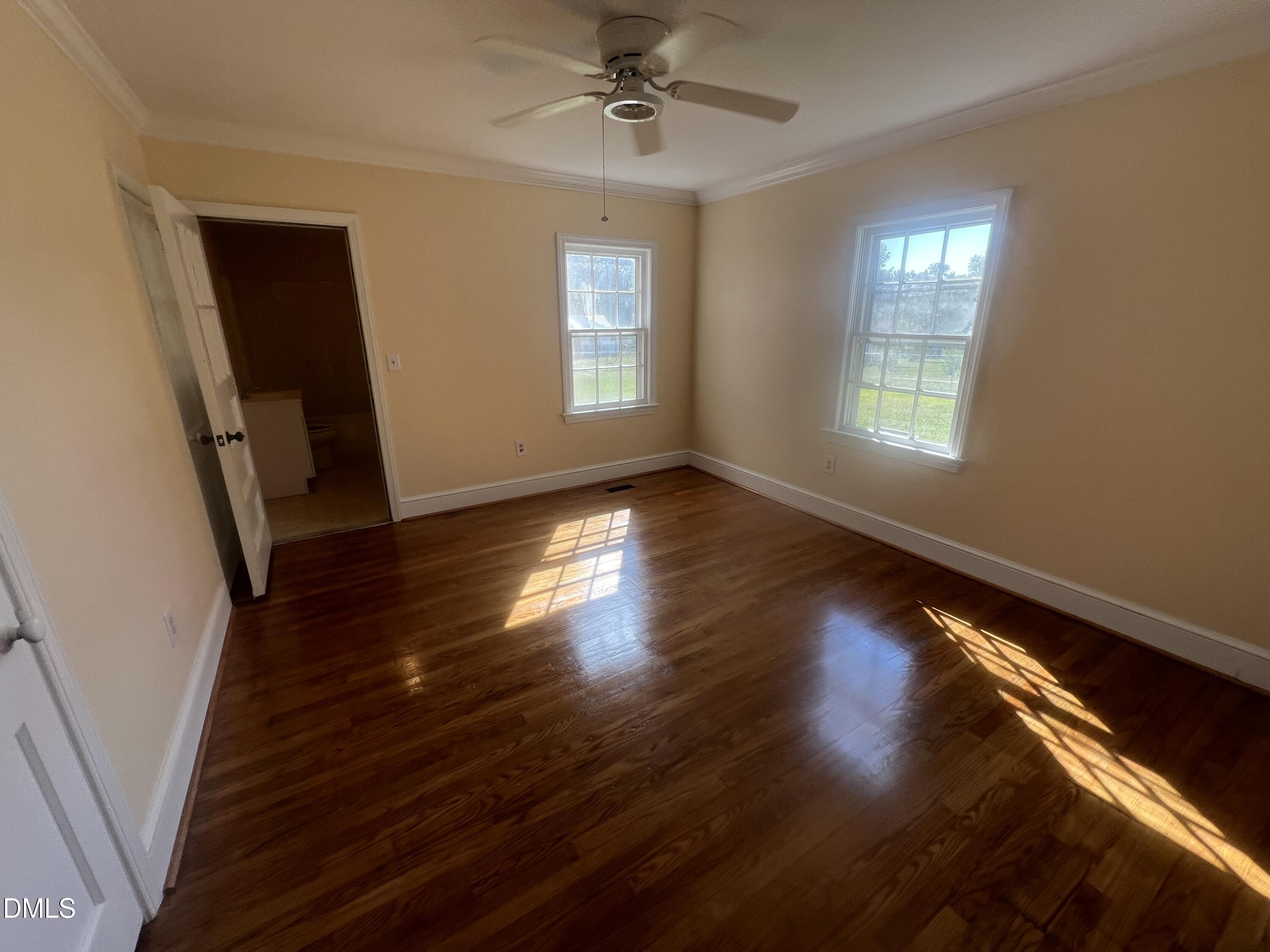 122 Bill Avery Road Coats, NC 27521 - Photo 19 of 51 wooden floor in an empty room with a window