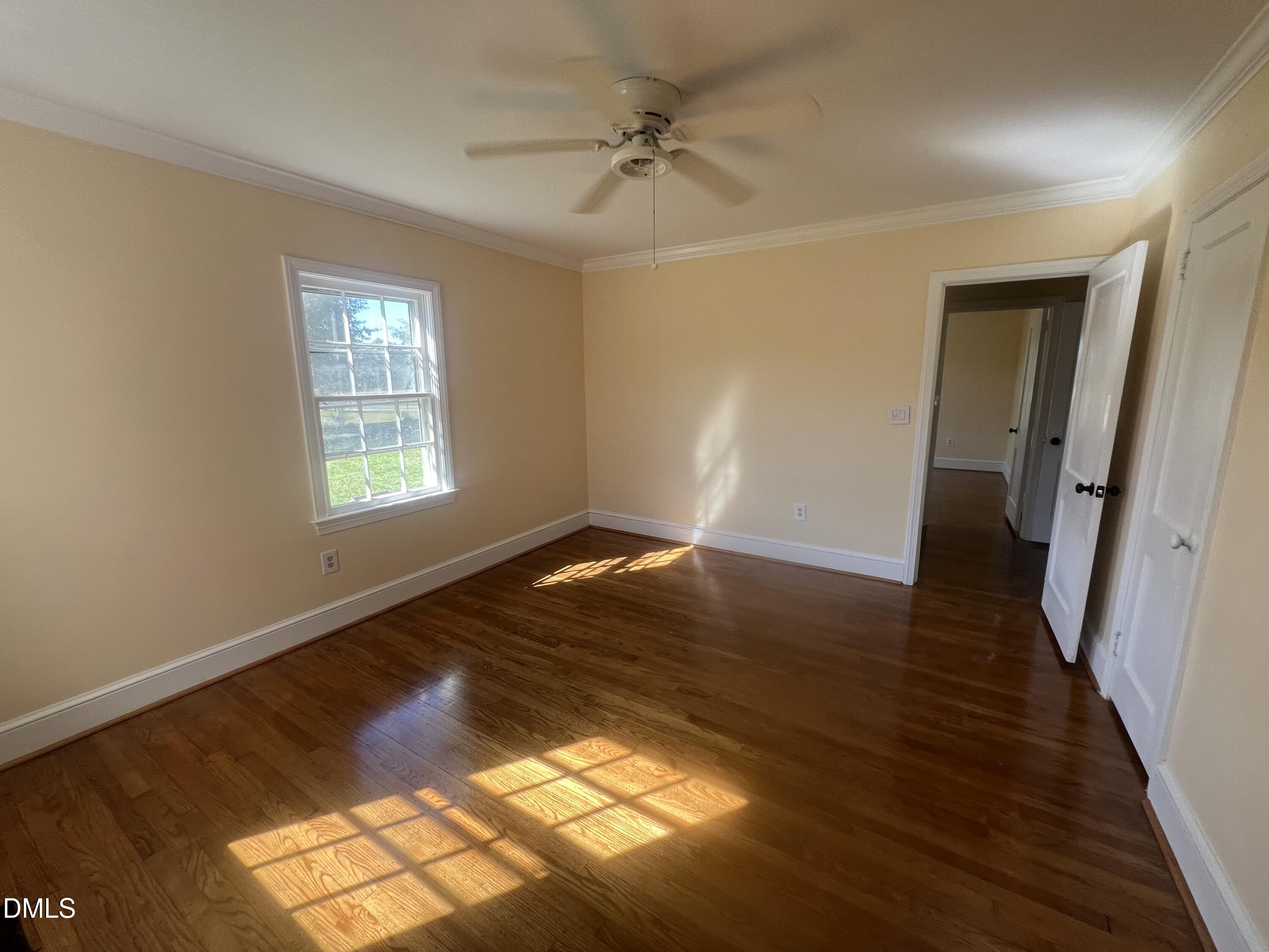 122 Bill Avery Road Coats, NC 27521 - Photo 24 of 51 wooden floor in an empty room with a window