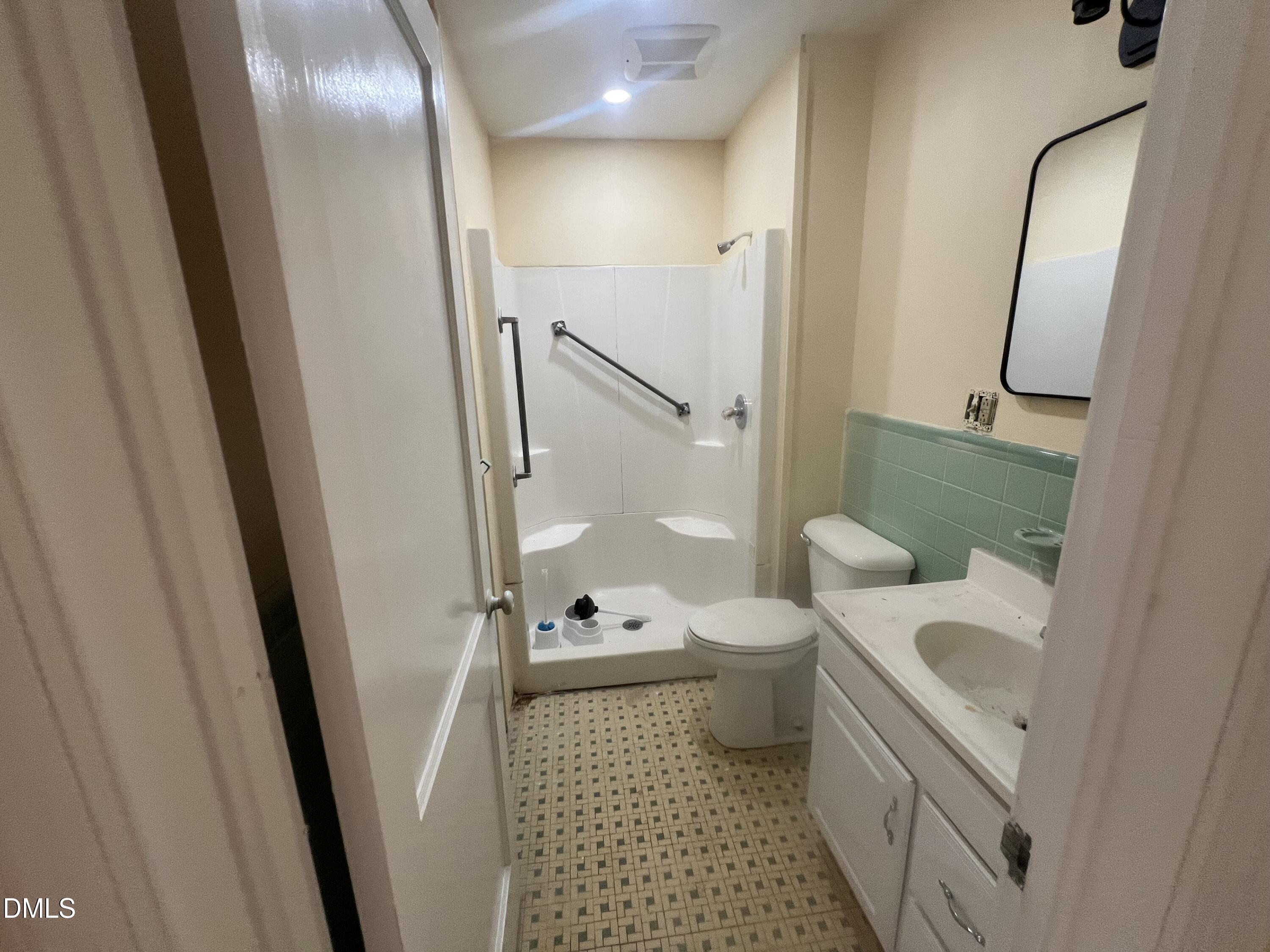 122 Bill Avery Road Coats, NC 27521 - Photo 26 of 51 a bathroom with a sink a toilet and shower