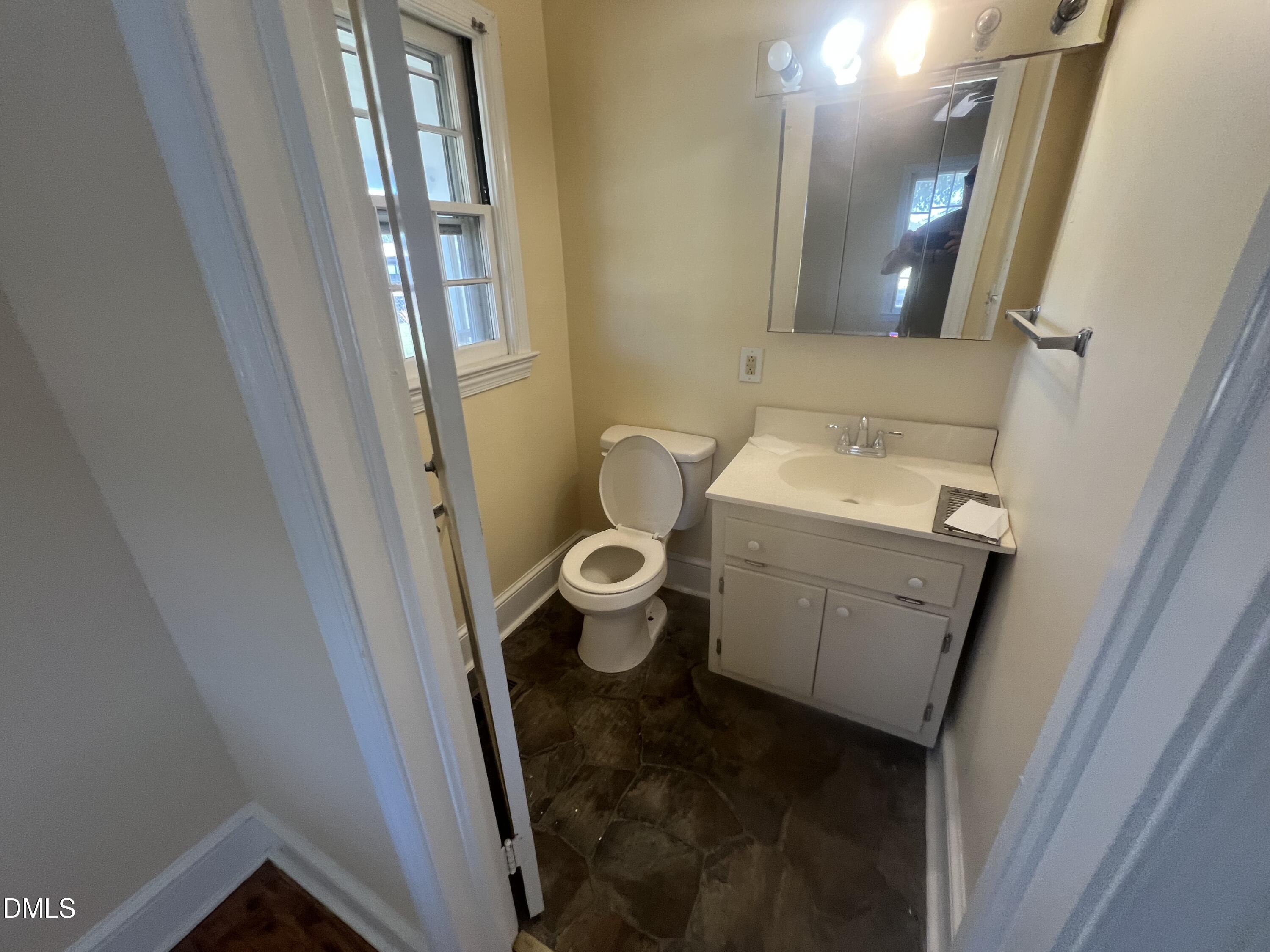 122 Bill Avery Road Coats, NC 27521 - Photo 44 of 51 a bathroom with a sink and toilet
