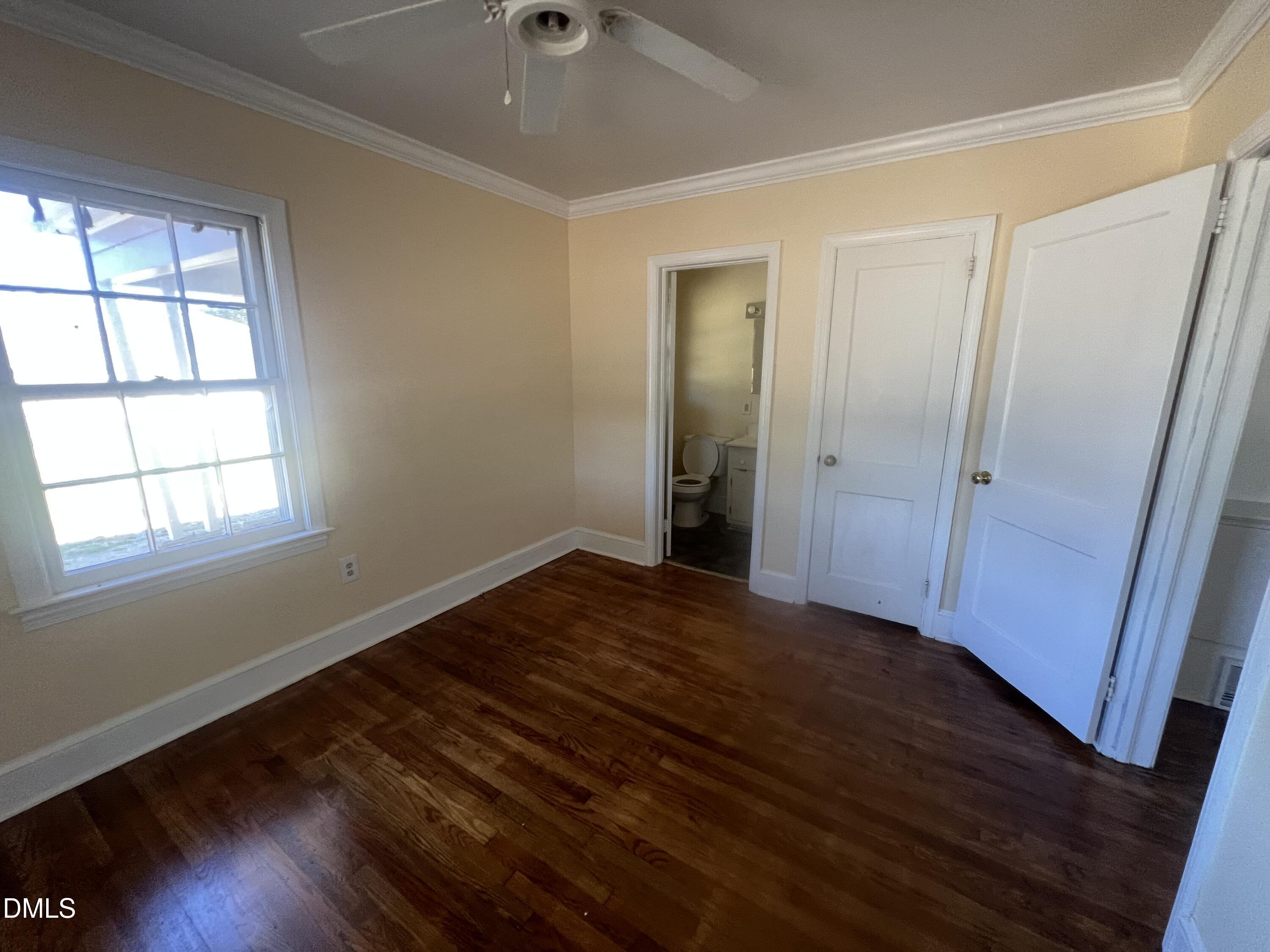 122 Bill Avery Road Coats, NC 27521 - Photo 47 of 51 wooden floor in an empty room with a window