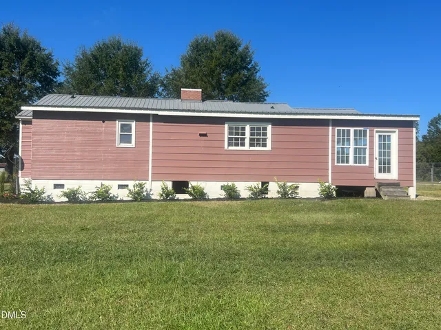 a brick house with a yard