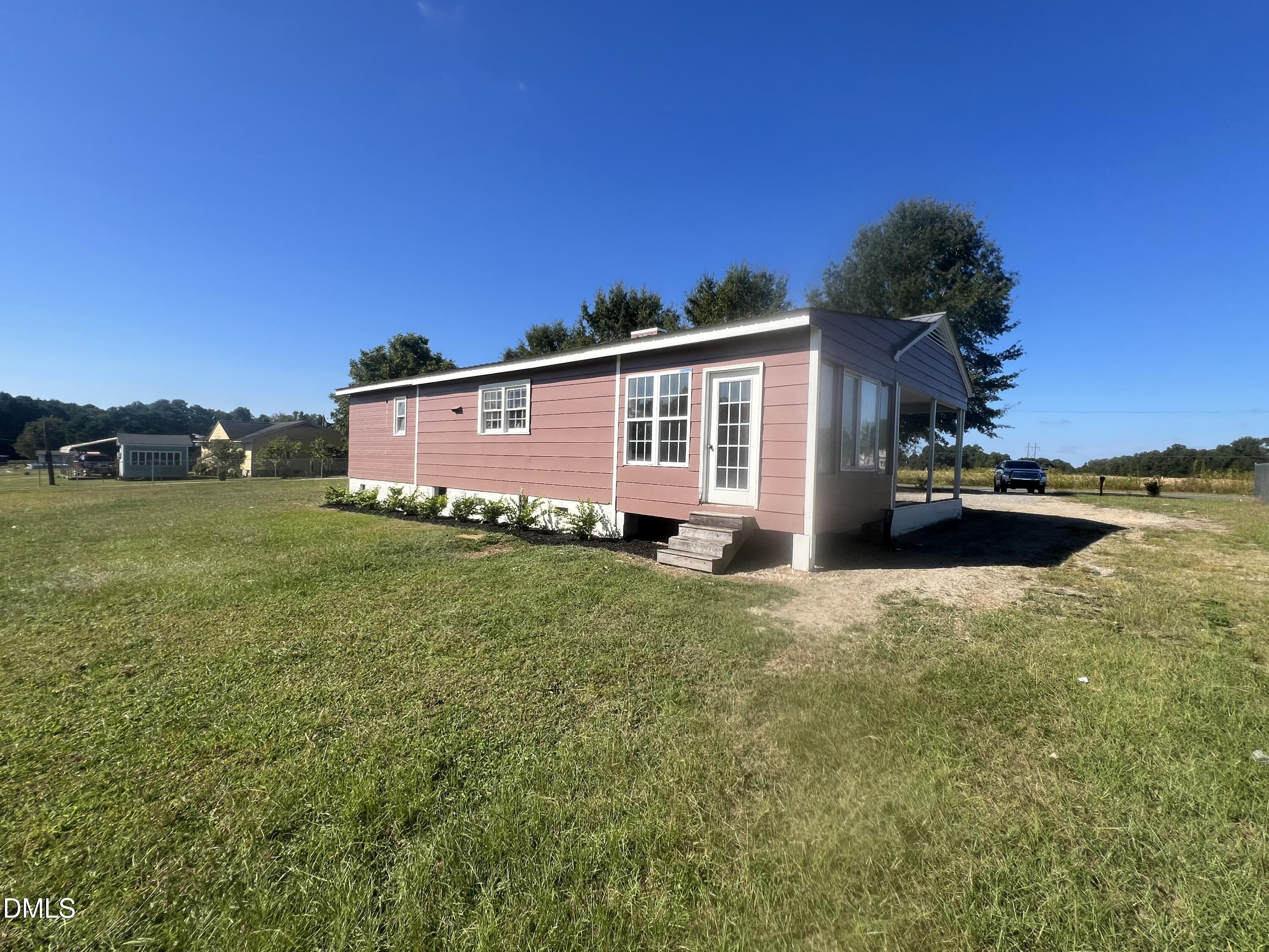 122 Bill Avery Road Coats, NC 27521 - Photo 6 of 51 a front view of house with yard and trees