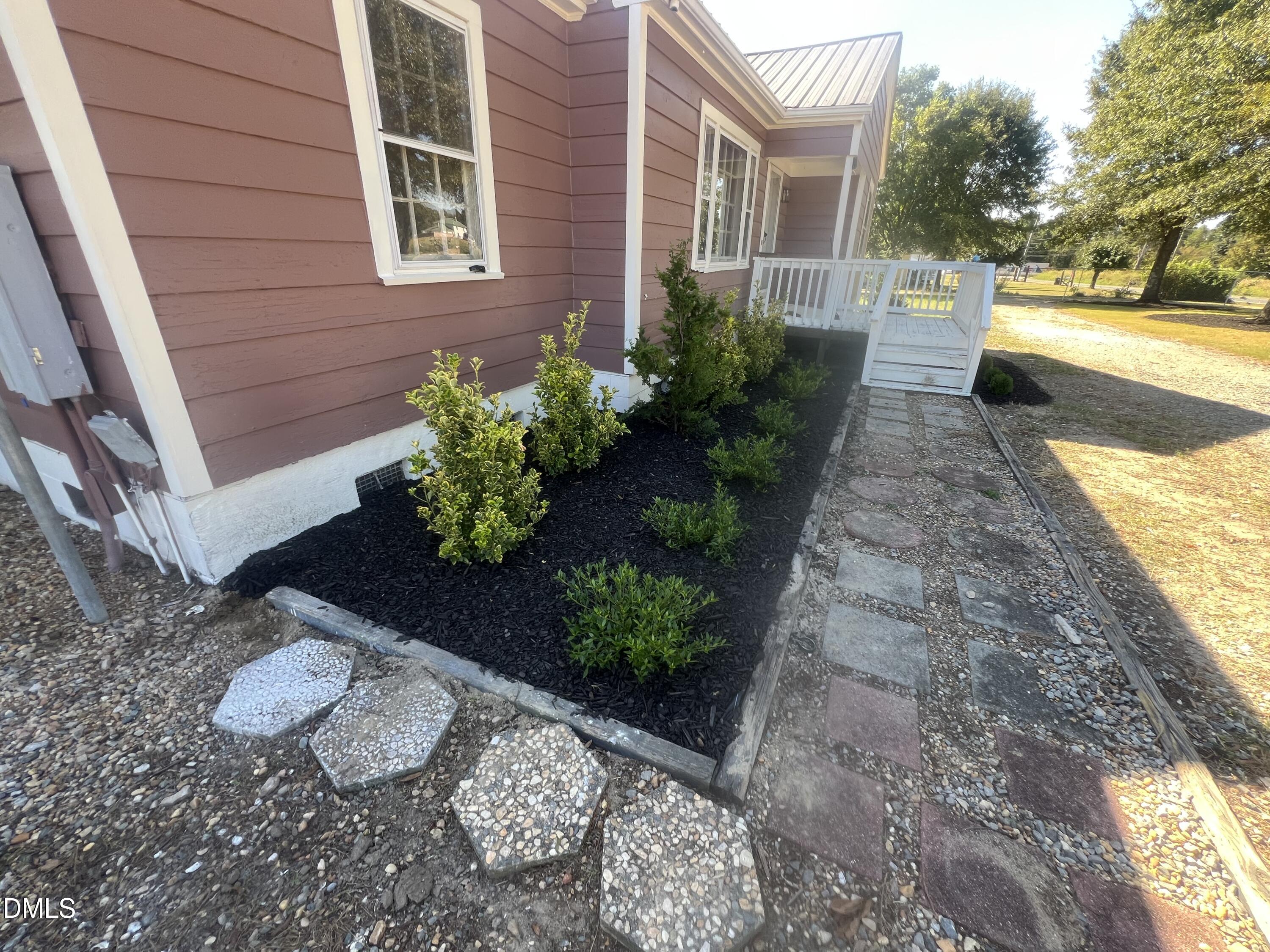 122 Bill Avery Road Coats, NC 27521 - Photo 8 of 51 a view of a house with a yard