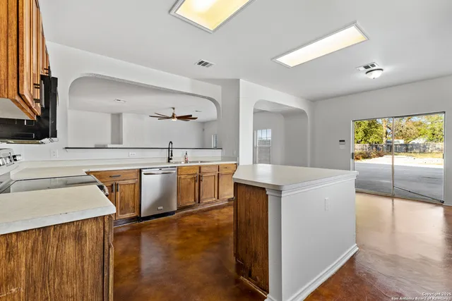 a view of a kitchen with furniture and windows