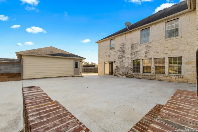 a view of a garden with a house
