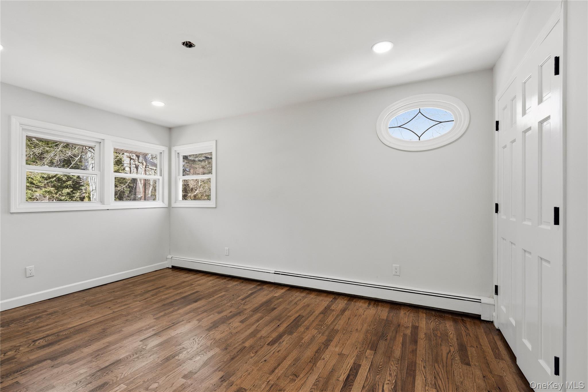 75 Hawthorne Road Kings Park, NY 11754 - Photo 19 of 34 a view of a room with wooden floor and window