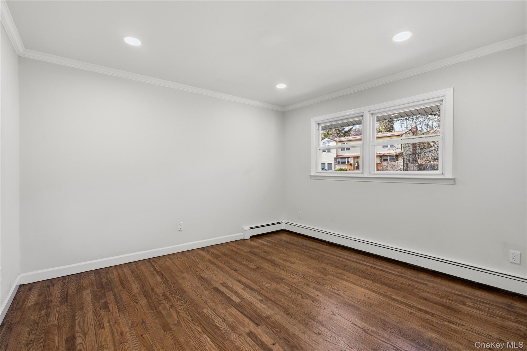 75 Hawthorne Road Kings Park, NY 11754 - Photo 21 of 34 a view of a room with wooden floor and window