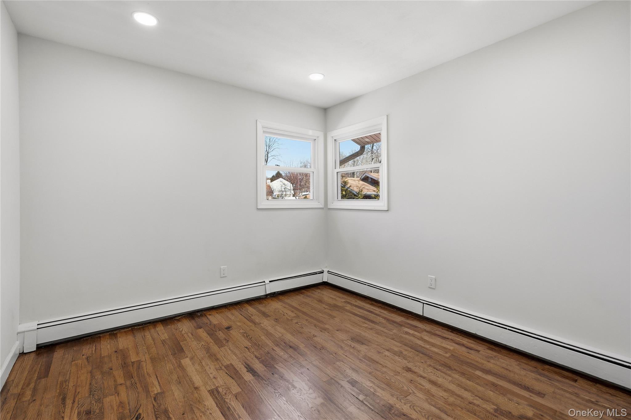 75 Hawthorne Road Kings Park, NY 11754 - Photo 22 of 34 a view of empty room with wooden floor