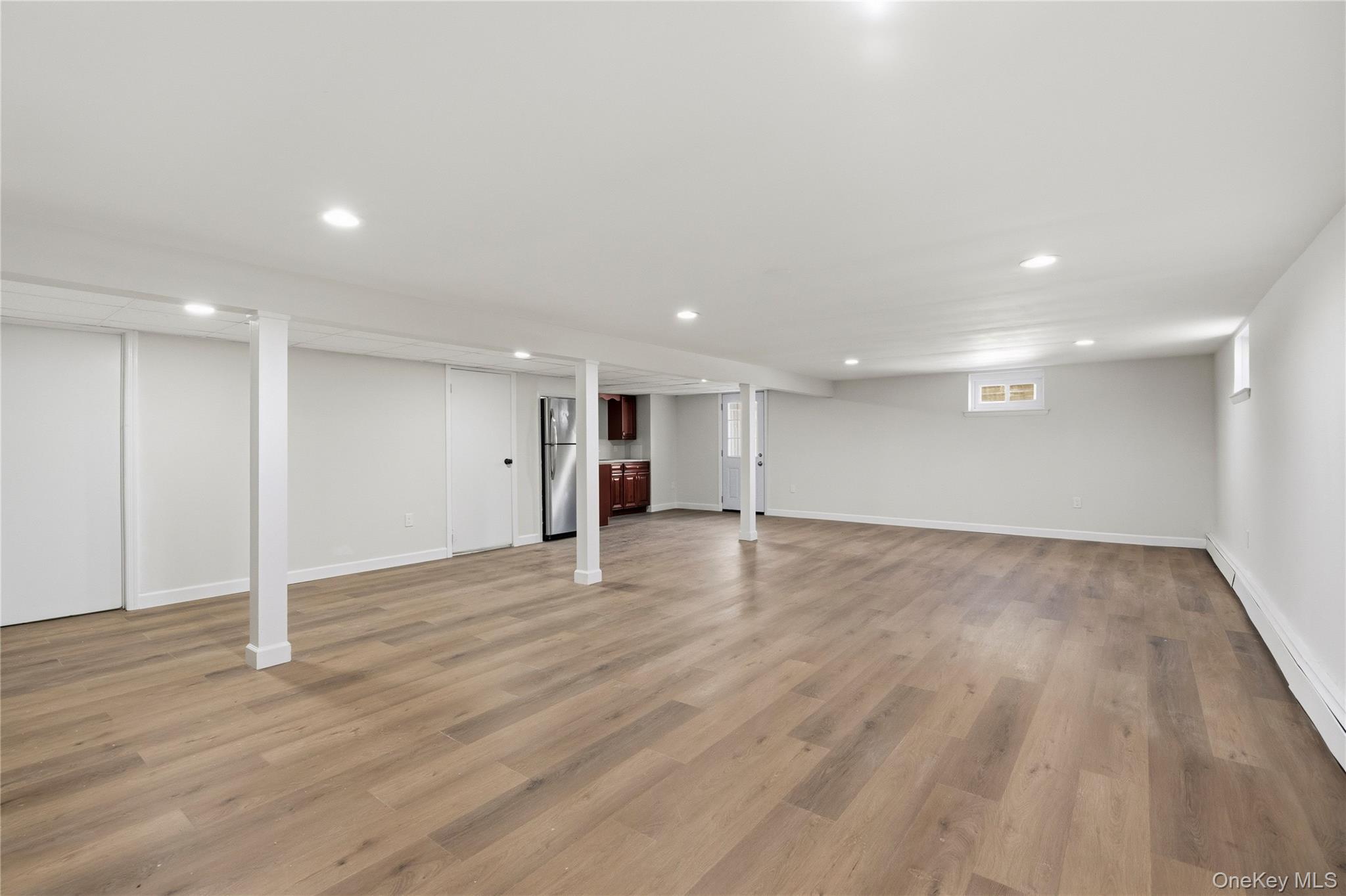75 Hawthorne Road Kings Park, NY 11754 - Photo 25 of 34 a view of an empty room with wooden floor
