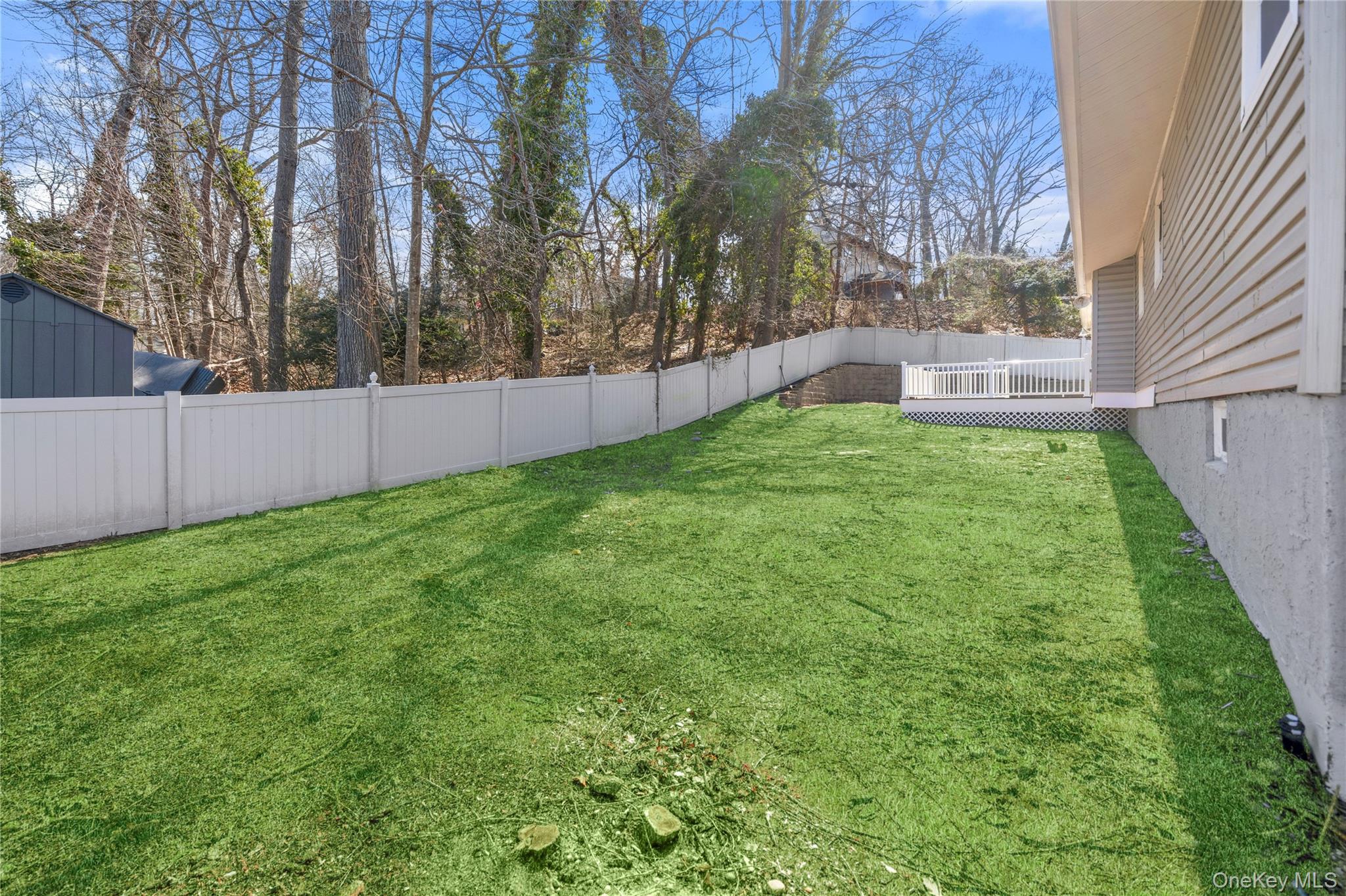 75 Hawthorne Road Kings Park, NY 11754 - Photo 31 of 34 a view of backyard with large trees