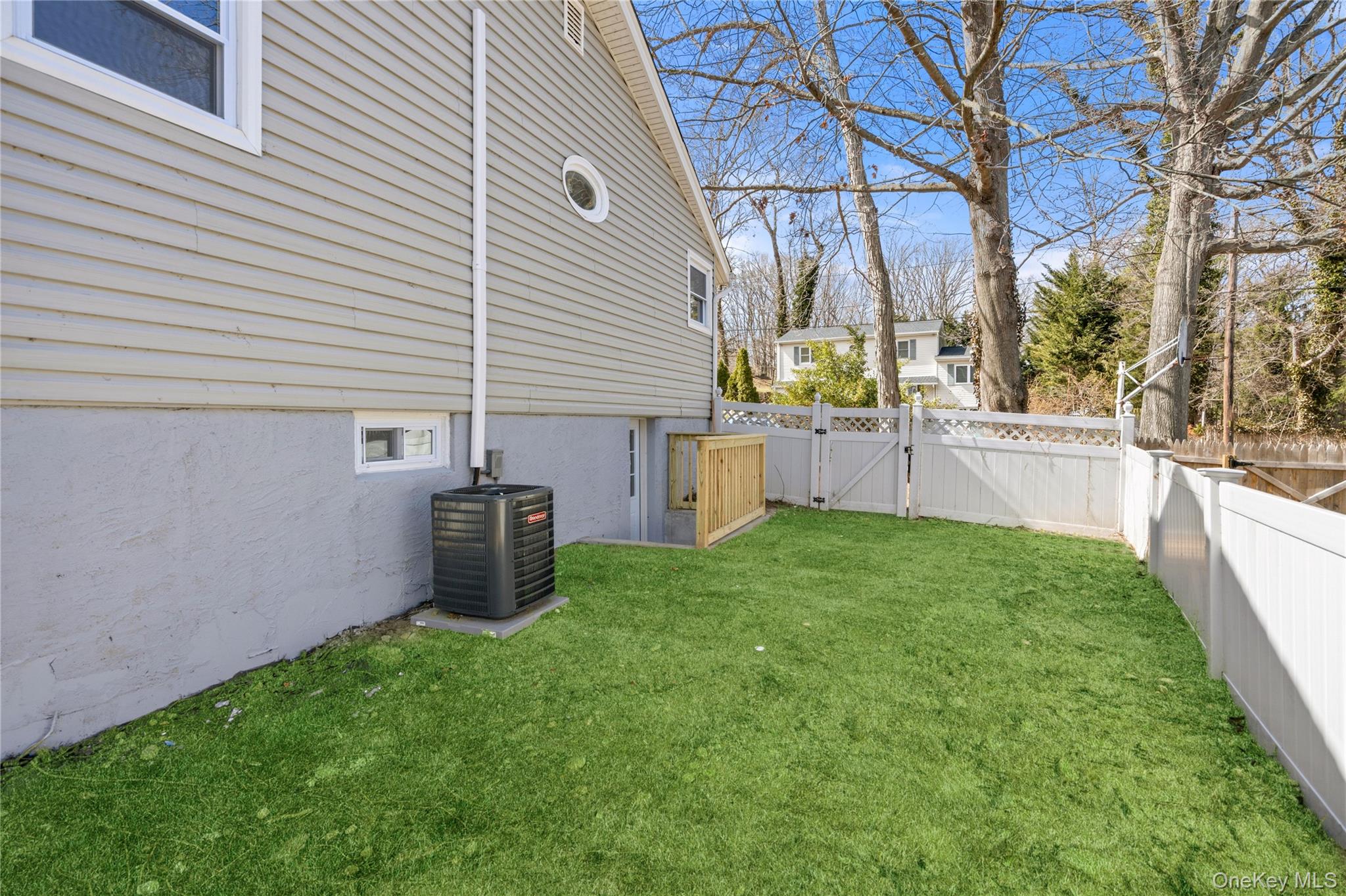 75 Hawthorne Road Kings Park, NY 11754 - Photo 32 of 34 a view of a backyard with garden and plants