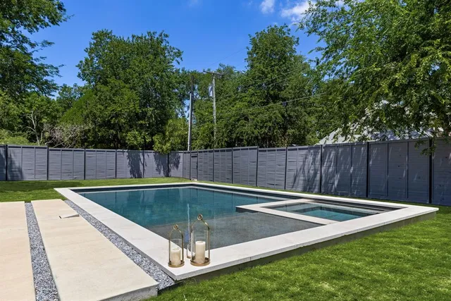 a view of a backyard with a small pool