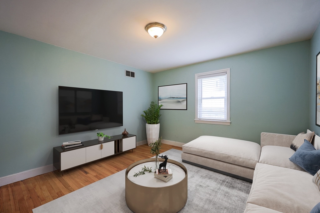 20 Kent Street Saugus, MA 01906 - Photo 11 of 41 a living room with furniture and a flat screen tv
